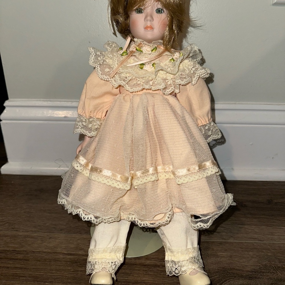 Vintage Porcelain Doll with Peach Dress
